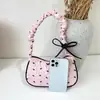 Bolso de lunares bolso de mujer 2026 nuevo fresco bolso de axila dulce bolso de mano plisado textura de nicho bolso de hombro único para mujer
