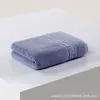 Al por mayor de fábrica directo comercio exterior algodón toalla suave absorbente hogar hotel algodón grueso ondulado limpiar cara toalla