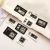 Nuevo en stock Etiqueta de Cuero Edición Gruesa Letras Inglesas Impresas Ropa Pantalones Bolsa Bufanda Sombrero Accesorios de Decoración Marca Registrada Personalizada