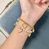 MOY Original Moda Francesa Temperamento Rosa Suave Corazón de Melocotón Forma de Corazón Piedra en Polvo Cadena de Perlas Pulsera al por Mayor