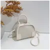Bolso tejido 2026, mini bolso de concha patchwork estilo coreano, se puede llevar cruzado, versátil para el trabajo, bolso de hombro de nicho