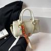 Bolso pequeño con textura popular de este año para mujer primavera y verano 2025 nuevo bolso de mensajero de un solo hombro bolso cuadrado pequeño portátil informal coreano