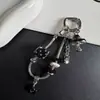 Correa de teléfono única y nueva de cadena de hueso de serpiente cuadrada con colgante creativo de hongo con goteo de aceite para bolsos y llaves