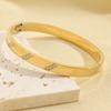 Nova moda europeia e americana pulseira chanfrada de três diamantes aço titânio ouro 18K Pulseira de diamante feminina que não desbota acessórios de cabelo