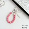 Nueva Cadena para Teléfono Móvil con Lazo de Perlas Bolso de Niña Colgante Exquisito Cuerda de Cuentas Rosas Cuerda de Muñeca Llavero de Coche
