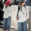 Camiseta base de algodón puro para niña 2026 nuevo modelo camiseta de dibujos animados de manga larga con cuello redondo para niños top de otoño