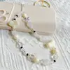Osito toffee crema corazón blanco y negro con cuentas cadena para teléfono móvil linda nicho todo-partido pareja novios cordón femenino