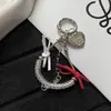 Cadena de hueso de serpiente de cable telefónico nueva y creativa con lazo personalizado, decoración versátil para bolso y accesorio para funda de teléfono