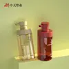 Botella dispensadora de plástico con pulsador para producto de cuidado de la piel 500 ml Botella para gel de baño y gel de ducha de PET Material de embalaje de lámina de oro electrochapada esmerilada