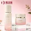 Set de botellas de vidrio de alta gama con degradado rosa 30ml/100ml empaque cosmético para productos de cuidado de la piel para damas