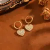 Conjunto de brincos com corrente em aço inoxidável 304 e pingente de coração listrado em ouro 18k transfronteiriço, luxo leve, moda feminina