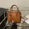 El color liso es popular este año para las mujeres, nuevo diseño casual de moda 2025, bolso de hombro cruzado simple y moderno