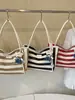 Bolso de mano tejido a rayas de moda transfronterizo 2026 nuevo versátil para el trabajo bolsa grande estilo coreano de gran capacidad para mujer