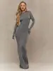 Vestido ajustado de cuello redondo y manga larga, superventas transfronterizo europeo y americano para mujer, con elástico, corte ceñido, mangas con agujero para el pulgar y bajo de sirena de color liso.