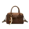 Bolso tipo Boston de diseño de nicho popular transfronterizo para mujer, estilo de viajero, nuevo bolso de hombro cruzado esmerilado otoño e invierno 2026