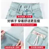 Jeans Feminino Cor Clara Bumbum de Pêssego Micro-desgastado Explosões da Primavera 2025 Cintura Alta Calças Cavalo Pequeno Laço de Ferradura