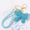 Llavero de Arco de Arcilla Cordón de Cuero Pequeño Regalo Pedrería Colgante de Llave de Metal Yiwu Pequeño Artículo Mayorista Transfronterizo