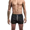 Nuevos pantalones de fitness de verano transfronterizos europeos y americanos para hombre, cómodos, transpirables, de color sólido, para correr, deportes de ocio y entrenamiento.