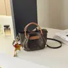 Bolsos populares para mujer transfronterizos este año: Nuevo bolso de cubo de mano súper popular para el otoño de 2026, bolso versátil de hombro y cruzado