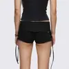 Shorts de mujer y2k de tiro bajo con cordones, estilo punk vintage con adornos de remaches, minishorts negros ajustados