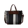 Bolso de lona rayado texturizado para mujer, gran capacidad, bolsa de mano vintage para el día a día, bolso cruzado de lona de nicho moderno y versátil