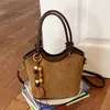 Bolso de mano para mujer estilo coreano transfronterizo 2026 nuevo bolso versátil bolso cubo retro simple bolso de hombro cruzado