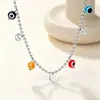 Cadena para la clavícula de joyería transfronteriza con diseño creativo de círculo hueco y cruz, collar de cuentas de ojo de color mixto, cadena de cuentas de acero inoxidable