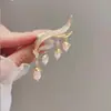 Novo broche estilo antigo de alta qualidade ins para mulheres estilo chinês leque borla pino de terno placket de pressão cheongsam corsage atacado