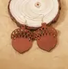 Venta caliente transfronteriza aretes de madera personalizados de moda con corte láser aretes retro artísticos con forma de nuez huecos y escamosos