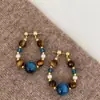 Nostalgia de Arce Estilo Chino Nuevo Pendientes de Ojo de Tigre con Perlas Azules para Mujer Pendientes Retro Bohemios de Vacaciones