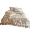 Juego de cuatro piezas de falda de cama de algodón de fibra larga ultrarresistente Clase A, estilo francés suave, juego de ropa de cama con funda nórdica de encaje jacquard 100% algodón