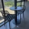 Juego pequeño de mesa y sillas redondas de acero al carbono simple para ocio en balcón, mesa de discusión, área de descanso, mesa de comedor para cafetería de té con leche al aire libre