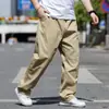Pantalones casuales de talla grande para hombre para primavera y otoño, extra grandes, holgados de pierna recta tipo cargo para hombres corpulentos, pantalones largos versátiles de cintura elástica