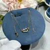 Collar Herradura V Chapado en Oro Oro de 18 Quilates Versión de Alta Gama Mini Tamaño Mediano Cadena de Clavícula de Lujo para Mujer Entrega Directa de Fábrica