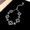 Pulsera Flor de Circonita Chapada en Oro Real Nicho Dulce Versátil Pulsera Temperamento Lujo Ligero Joyería de Gama Alta para Mujeres Al Por Mayor