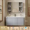 Tocador de baño engrosado y ahorrador de espacio con diseño en color crema, que cuenta con un lavabo redondeado, lavabo cerámico integrado y un lavabo de una sola pieza.