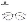 Gafas de madera STUDIOMUKU con montura redonda, montura ovalada, montura única, transparente, con lentes planas.