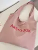 46203 Bolso de hombro tipo tote rosa claro con estampado de letras estilo coreano, bolsa de lona de gran capacidad para estudiantes y para ir al trabajo, bolso de lona versátil