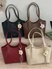 Bolso grande de Shuai Mi Jia para mujer 2026 nuevo bolso de hombro de nicho para el trabajo para estudiantes universitarios que van a clase bolso tote