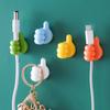 Organizador de ganchos para el pulgar creativo al por mayor de fábrica, soporte de alambre multifuncional, pegatinas de gancho sin perforaciones y sin costuras