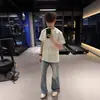 Tendência Nacional Camiseta de Manga Curta com Gola Redonda Bordada Estilo Americano para Homens e Mulheres, Marca da Moda de Verão Tops Casuais Soltos Versáteis para Casal