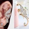 Joyería Yi moda europea y americana personalizada clip de oreja sin perforación mariposa de cristal pendientes de botón pendientes individuales para mujer joyería pequeña de Yiwu