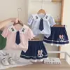 Conjunto de falda corta para niña, nueva colección de verano 2026, elegante y lindo, con cuello de conejo y manga corta, un conjunto de dos piezas de moda