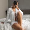 2025 primavera y verano transfronterizo Europa y Estados Unidos nuevo traje de pijama blanco jacquard calado cárdigan manga larga pantalones cortos ropa de casa para mujer