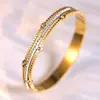 Pulsera de Trébol de Cuatro Hojas Pulsera de Acero Inoxidable para Mujer Pulsera de Acero de Titanio Color Dorado con Diamantes Estilo Blanco y Negro Joyería Que No Se Desvanece Transfronterizo