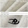 Pantalones de chándal anchos color blanco roto con raya lateral Bordado de logotipo pequeño Cintura con cordón Holgados Se pueden remangar Casual Deportivos Pantalones largos