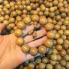 Pulseras de Madera de Nueve Hilos al por Mayor de Fábrica, Pulseras de Cuentas Budistas de Seis Hilos de Madera de un Solo Círculo, Pulseras de Madera de Estilo Étnico para Hombres y Mujeres, Regalos de Año Nuevo