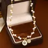 Cuentas Chapadas en Oro Real Collar de Perlas de Concha de Oro de 18 Quilates Cadena Corta para Clavícula Popular en Japón y Corea Lujo Accesible de Gama Alta para Mujeres
