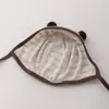 Gorros Coreanos para Bebé Qiunan 2026 Primavera y Otoño Bloqueo de Color para Recién Nacido Protección para Orejas Gorros para Bebé Venta al por Mayor
