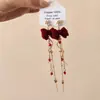 Pendientes de Borlas con Lazo Rojo 2026 Nuevo Estilo Caliente Lujo Ligero Gama Alta Pendientes de Año Nuevo Accesorios de Oreja Únicos de Nicho
